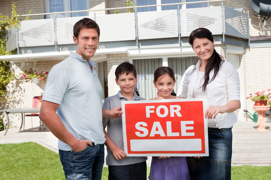 Portrait of family selling their house